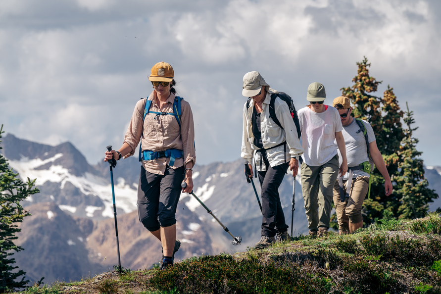 a guide leads a group of summer hikers at Whitecap Alpine